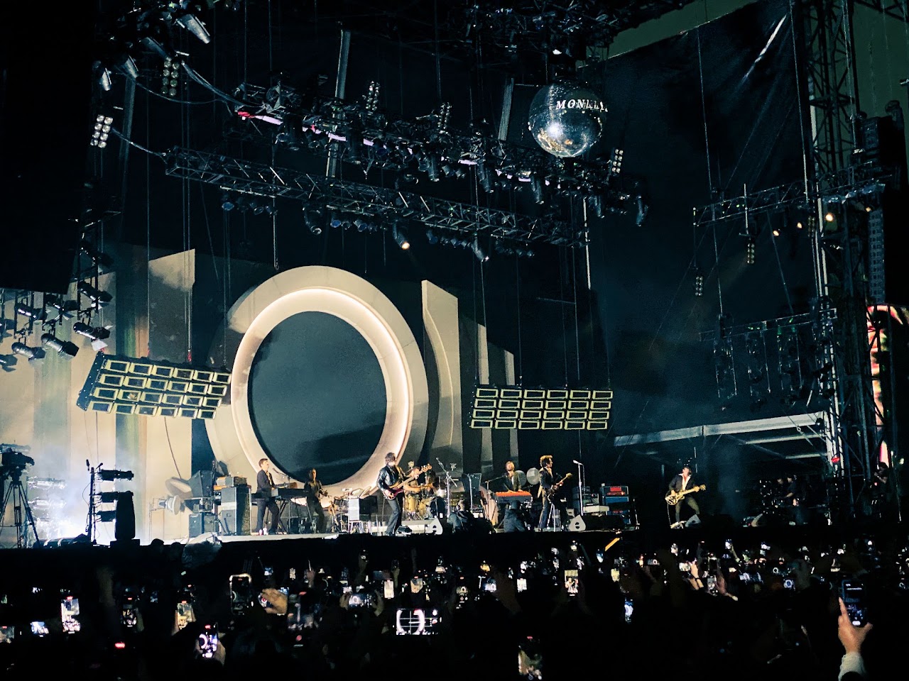 Arctic Monkeys performing live, photographed by Ludovic Delot