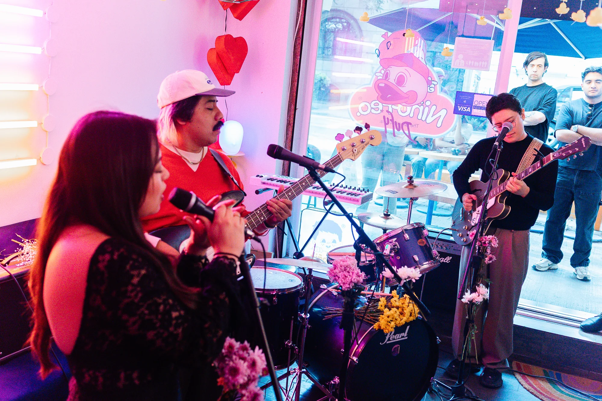 The band playing together in the room, photographed by Ludovic Delot
