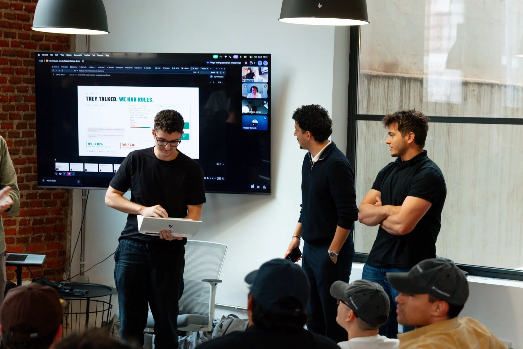 The audience follows the final presentations at the Claude Community Madrid Hackathon, photographed by Ludovic Delot