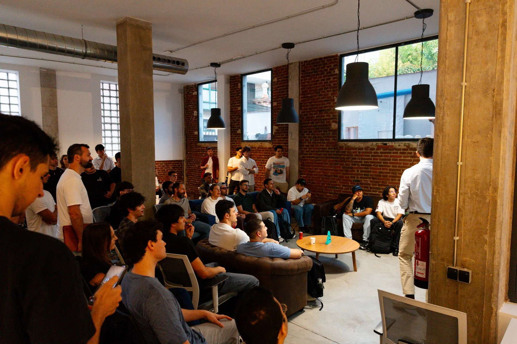 A talk gathers the room at the Claude Community Madrid Hackathon, photographed by Ludovic Delot