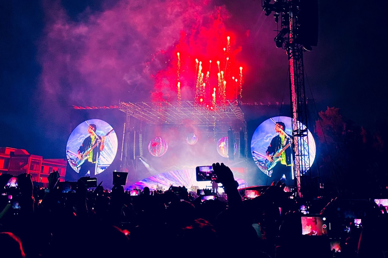 Coldplay performing live, photographed by Ludovic Delot