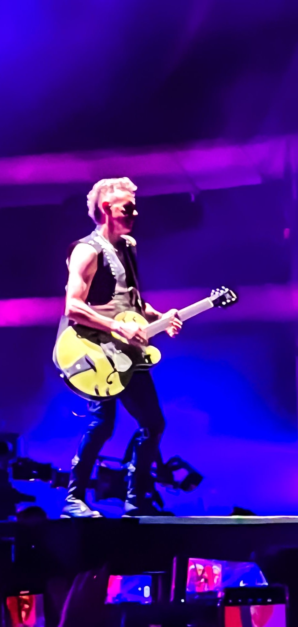 Depeche Mode performing live, photographed by Ludovic Delot