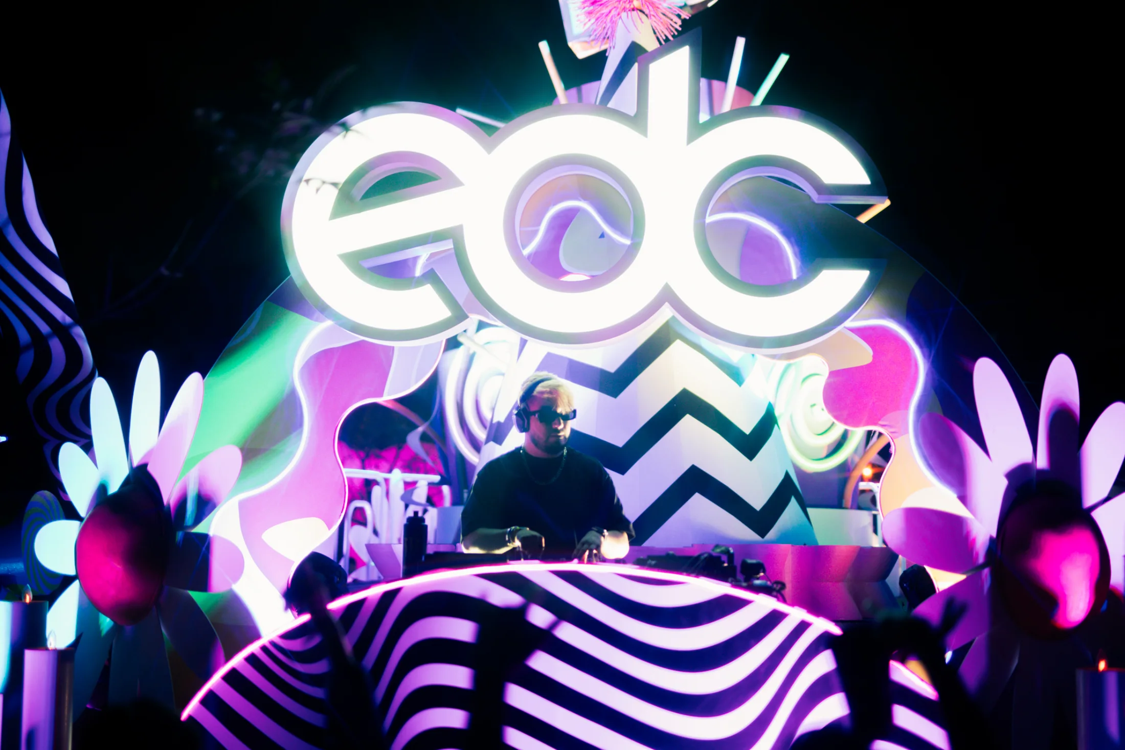 OLSE performing beneath the illuminated EDC sign.