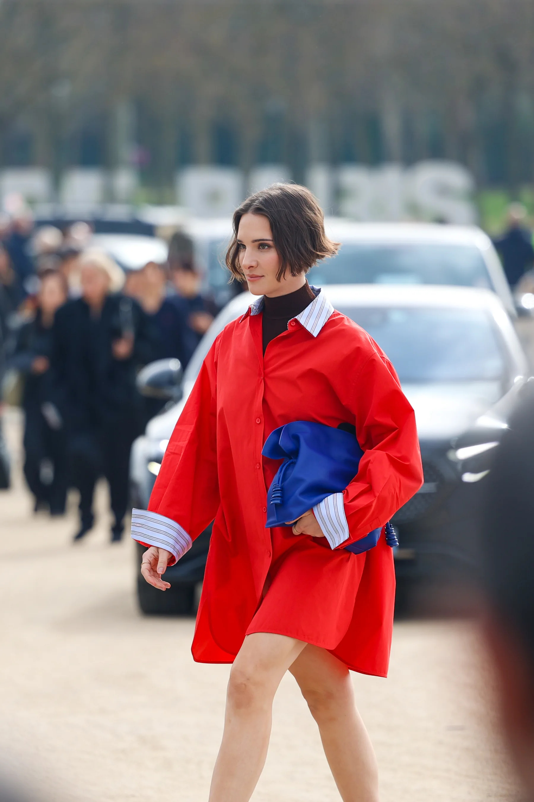 Street-style photograph outside the LOEWE FW26 show during Paris Fashion Week, frame 03 of 34, photographed by Ludovic Delot