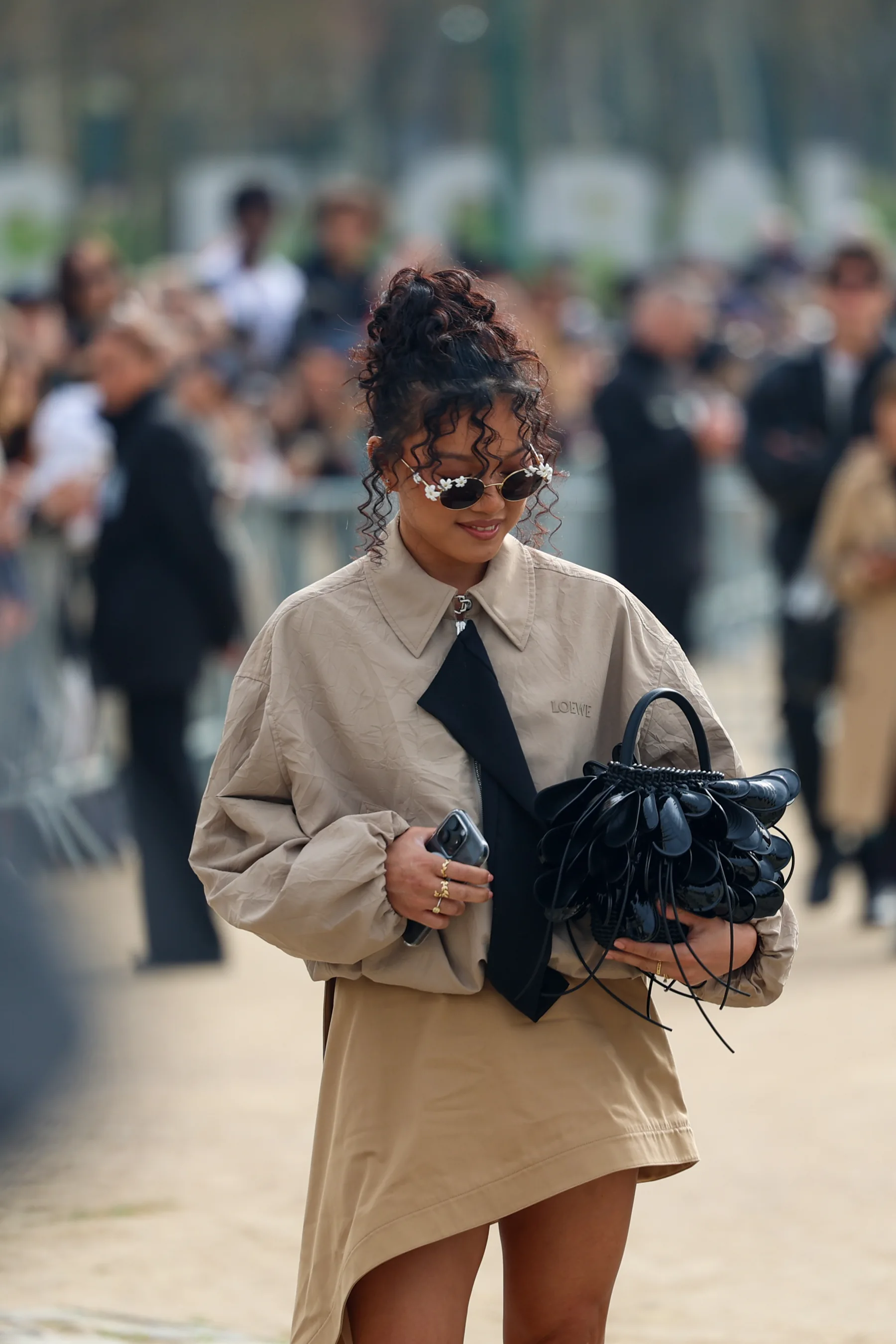 Street-style photograph outside the LOEWE FW26 show during Paris Fashion Week, frame 06 of 34, photographed by Ludovic Delot