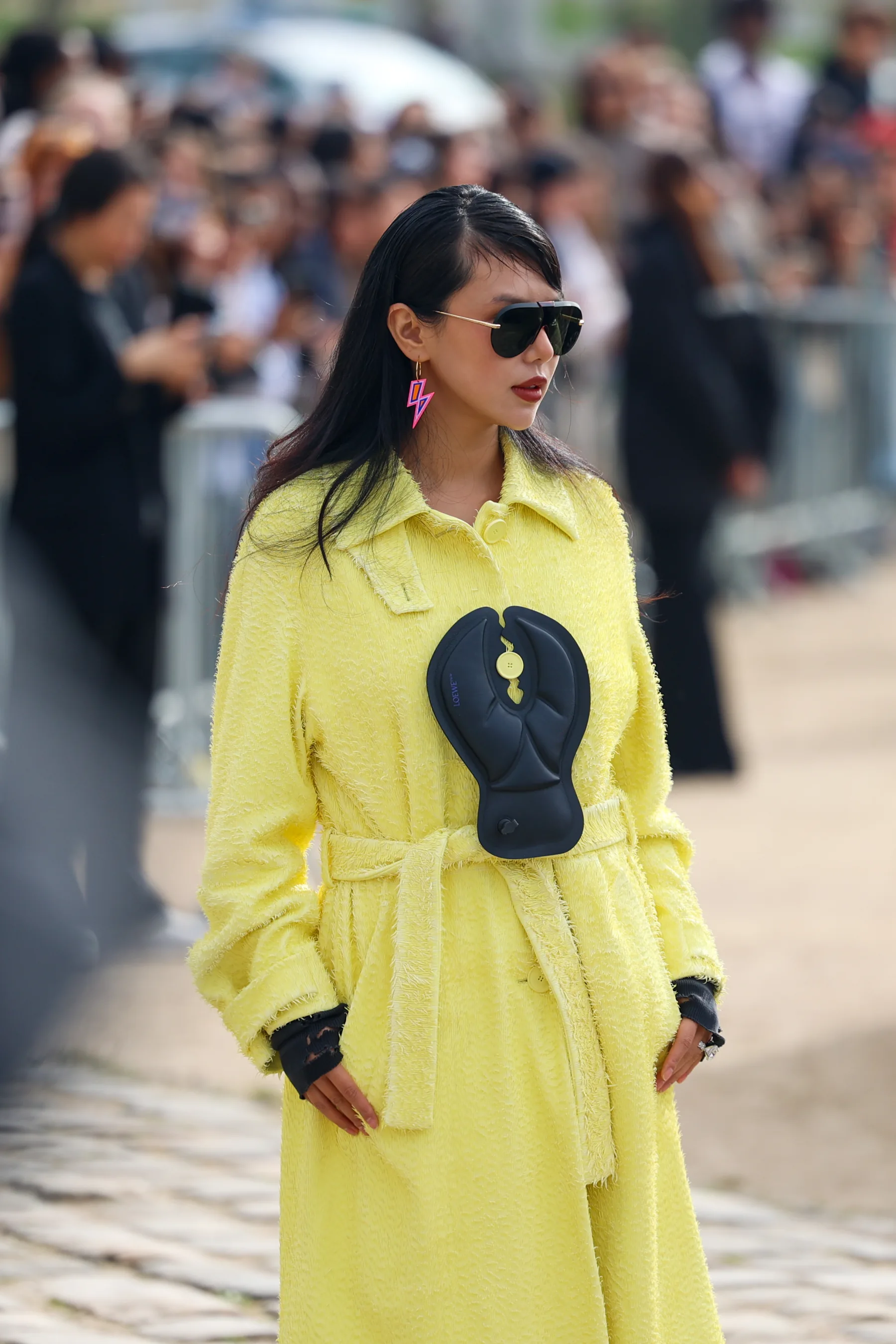Street-style photograph outside the LOEWE FW26 show during Paris Fashion Week, frame 08 of 34, photographed by Ludovic Delot