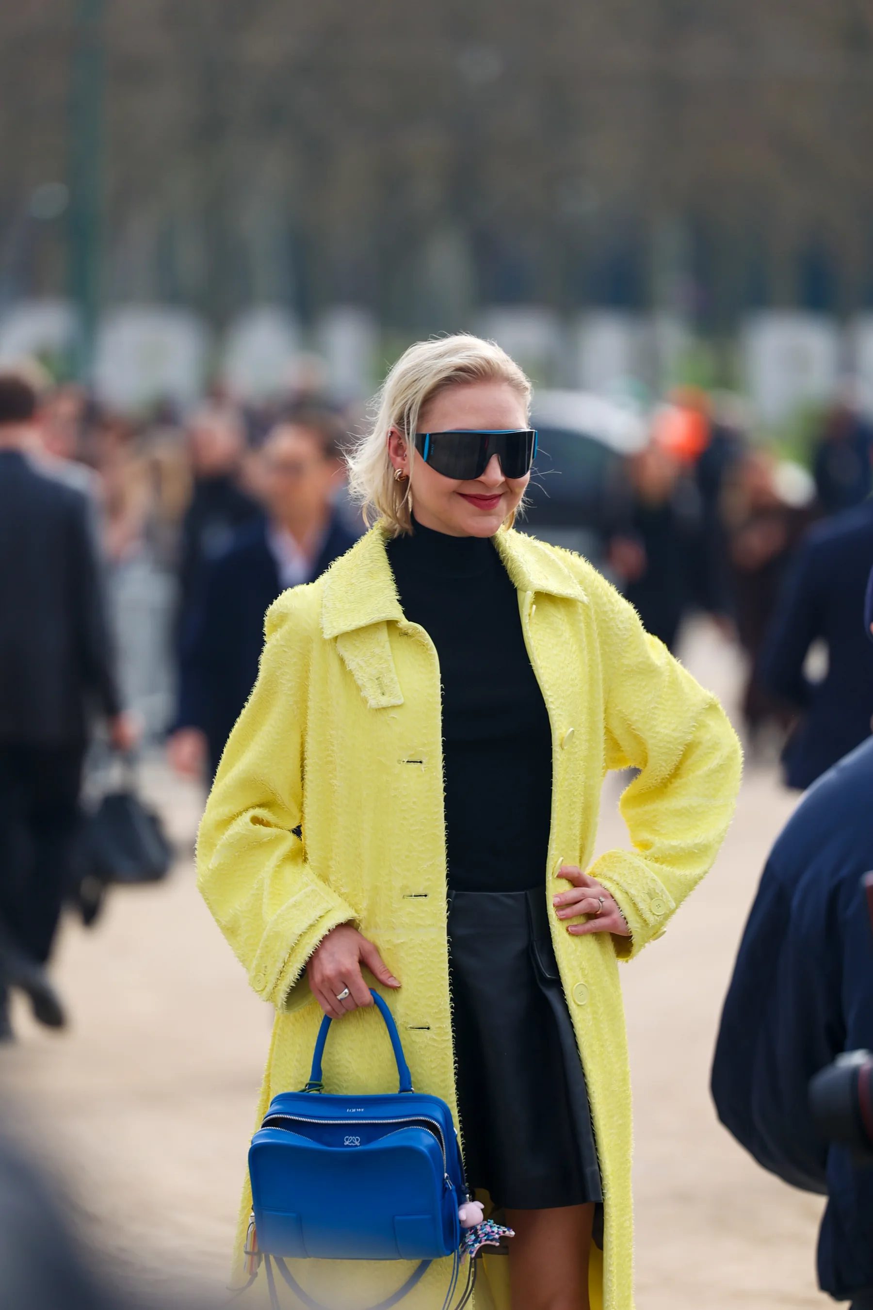 Street-style photograph outside the LOEWE FW26 show during Paris Fashion Week, frame 10 of 34, photographed by Ludovic Delot