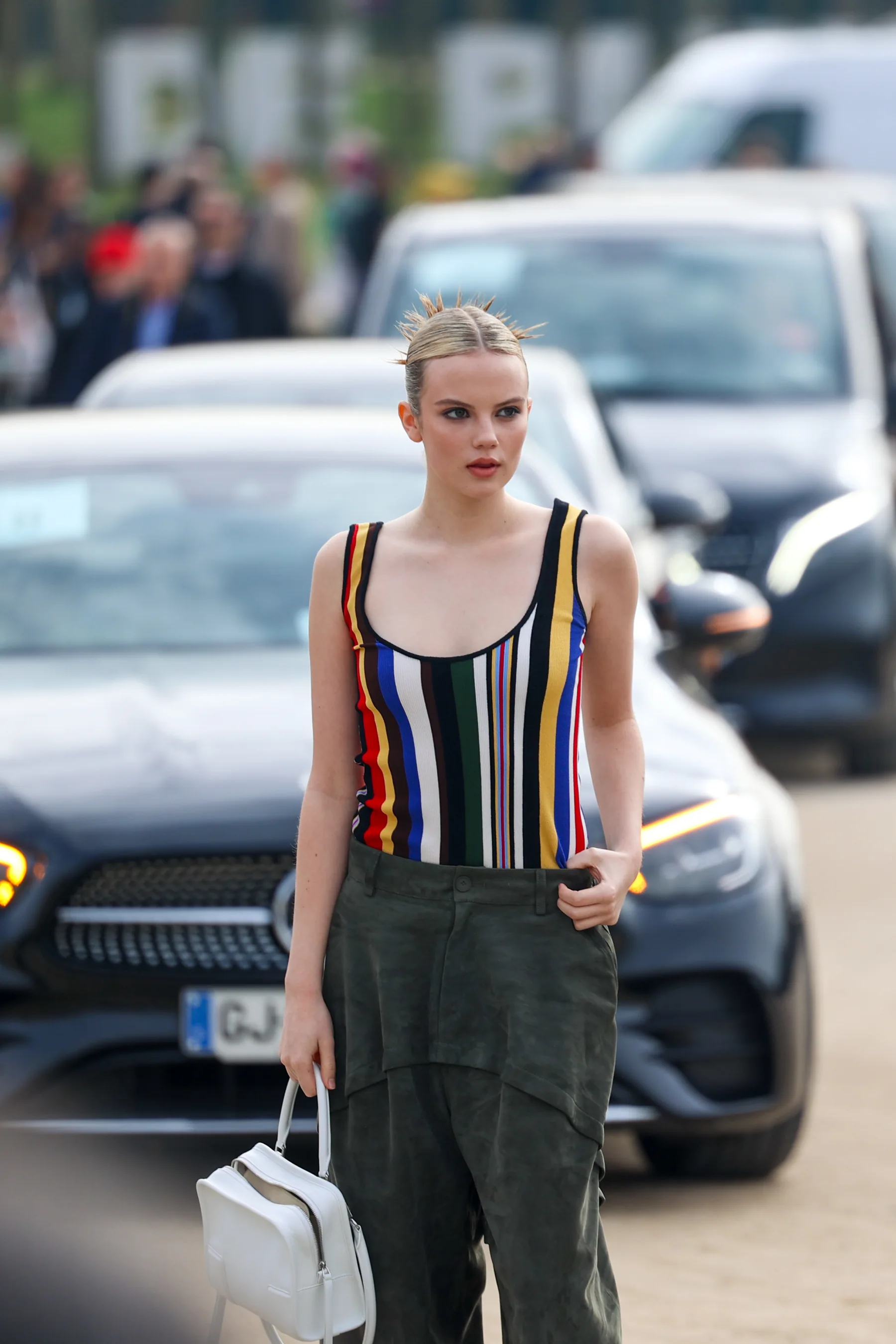 Street-style photograph outside the LOEWE FW26 show during Paris Fashion Week, frame 12 of 34, photographed by Ludovic Delot