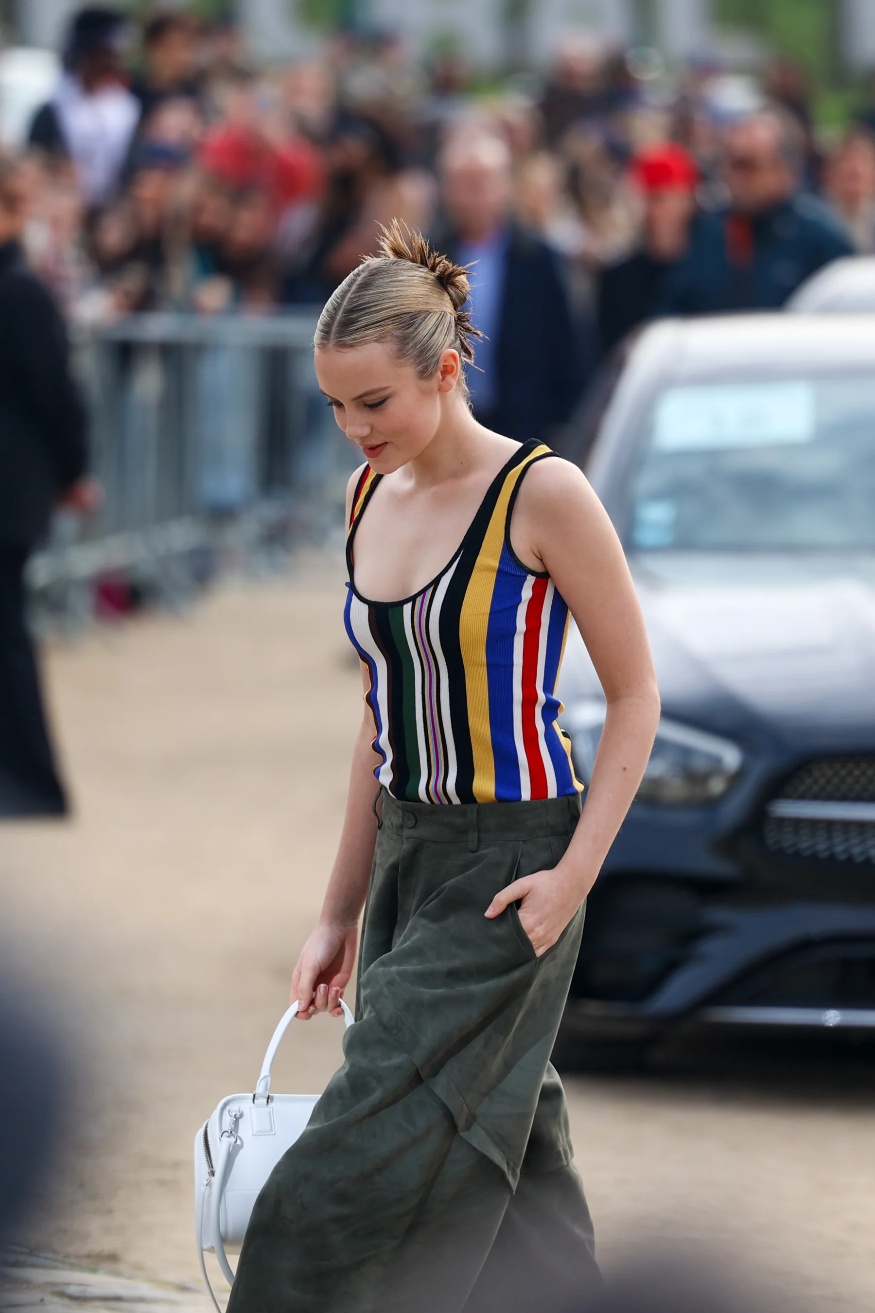 Street-style photograph outside the LOEWE FW26 show during Paris Fashion Week, frame 13 of 34, photographed by Ludovic Delot