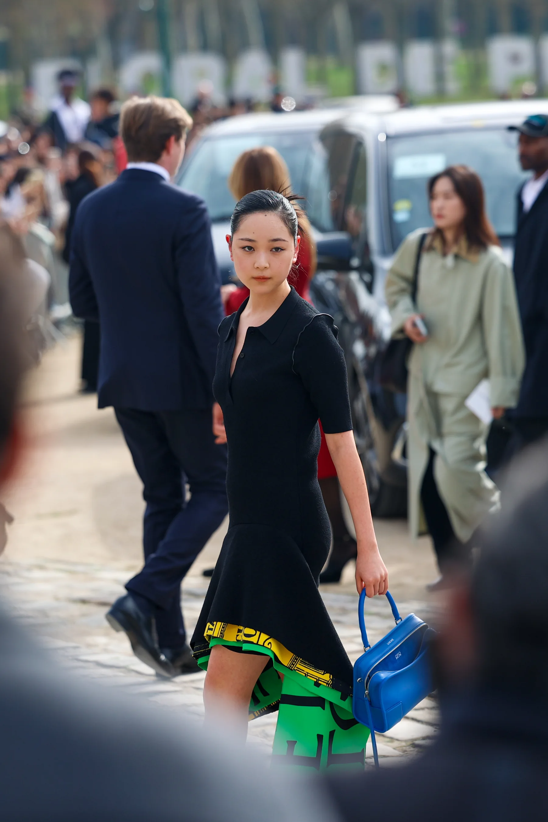 Street-style photograph outside the LOEWE FW26 show during Paris Fashion Week, frame 18 of 34, photographed by Ludovic Delot