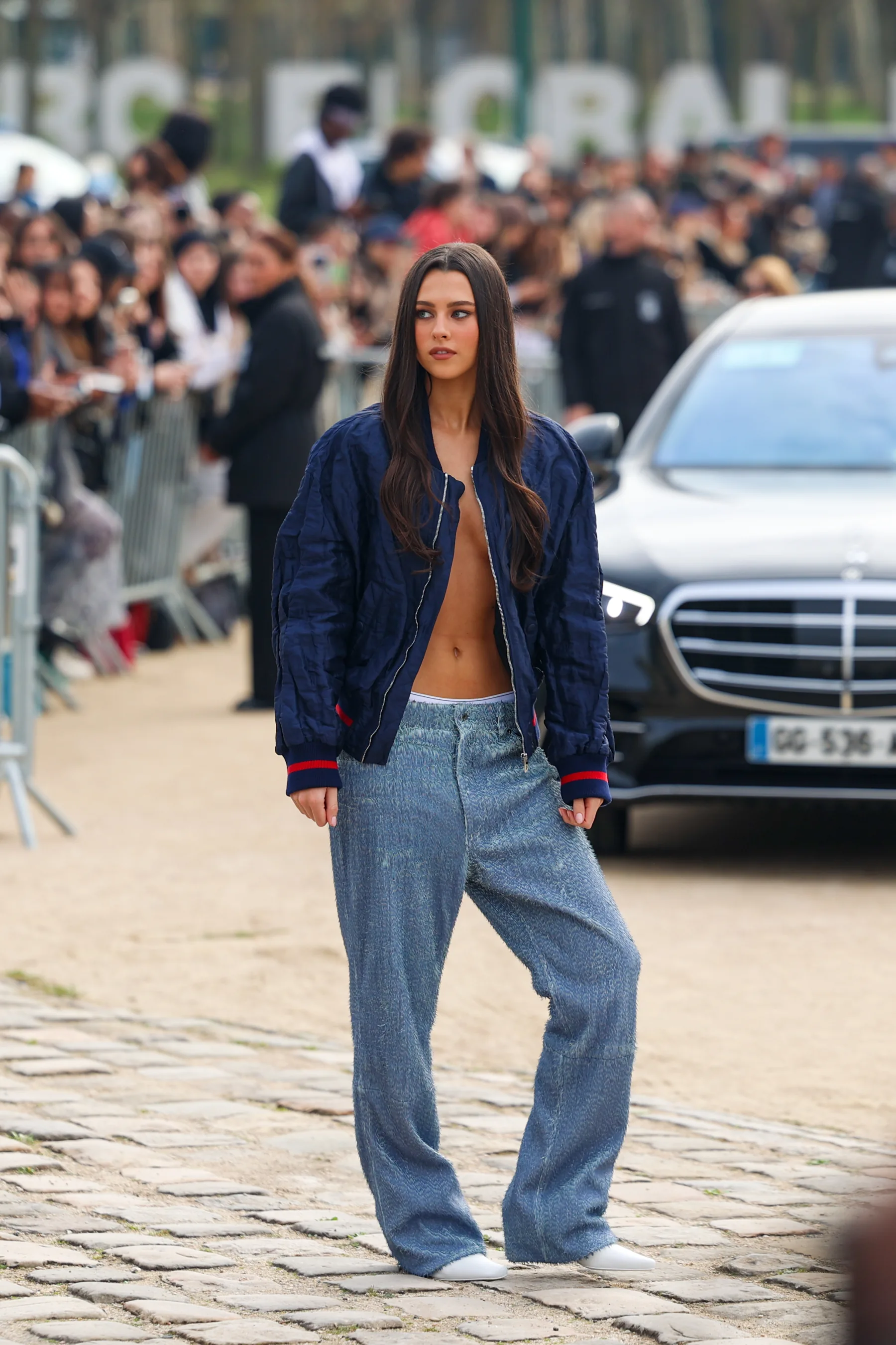 Street-style photograph outside the LOEWE FW26 show during Paris Fashion Week, frame 20 of 34, photographed by Ludovic Delot