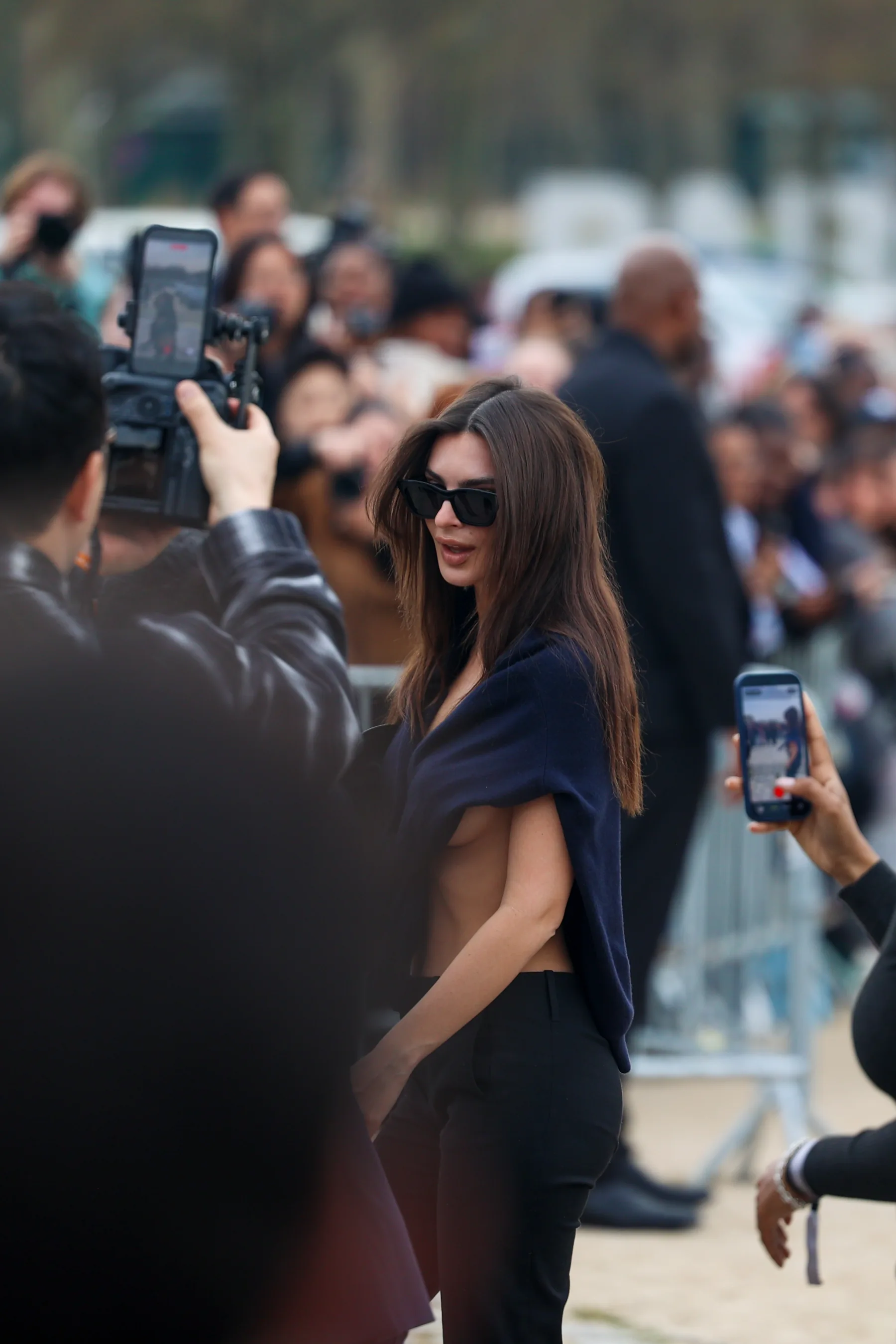 Street-style photograph outside the LOEWE FW26 show during Paris Fashion Week, frame 25 of 34, photographed by Ludovic Delot
