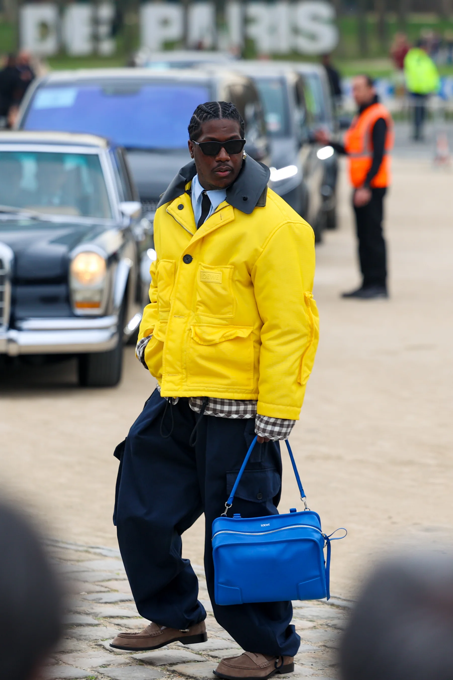 Street-style photograph outside the LOEWE FW26 show during Paris Fashion Week, frame 30 of 34, photographed by Ludovic Delot
