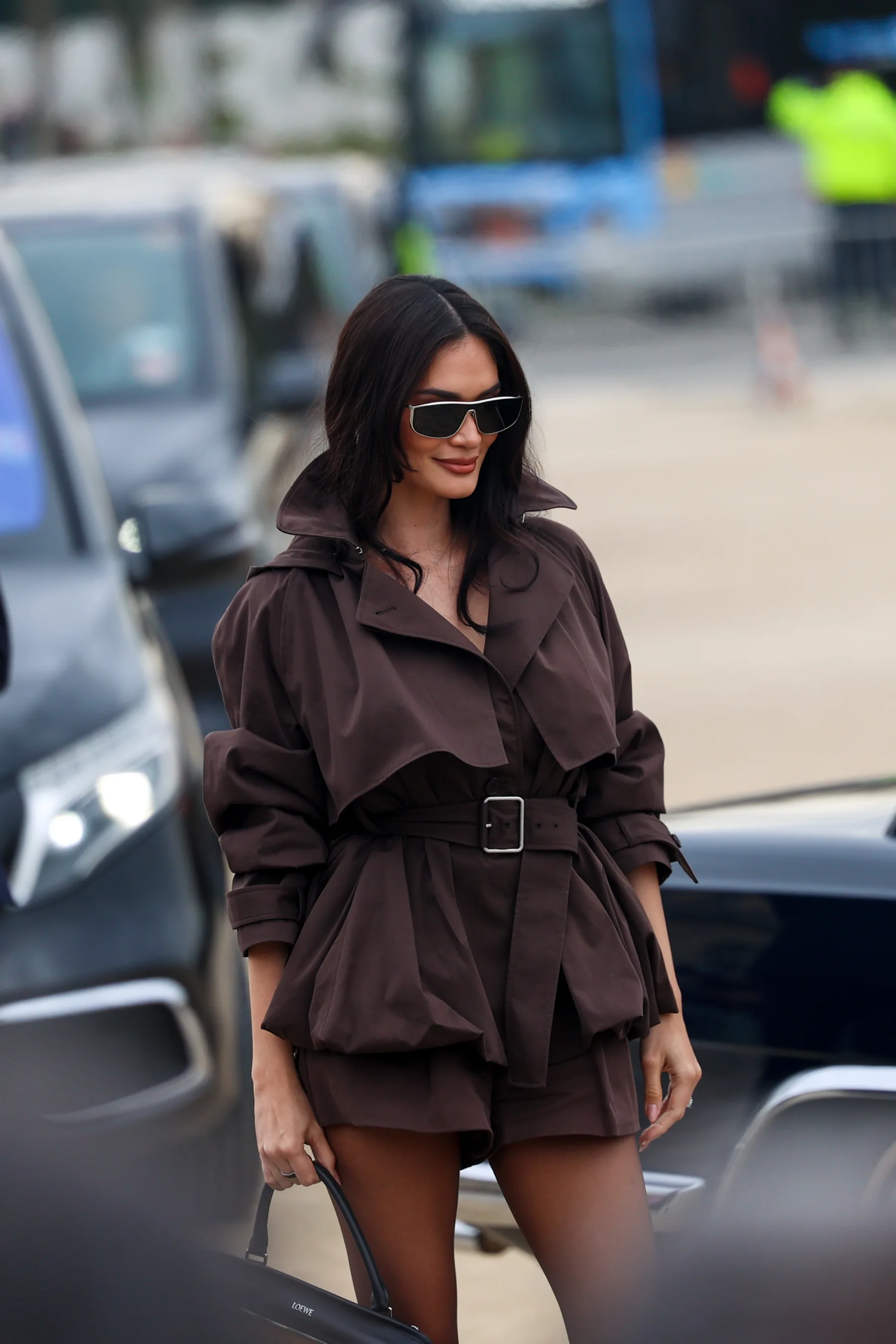 Street-style photograph outside the LOEWE FW26 show during Paris Fashion Week, frame 31 of 34, photographed by Ludovic Delot