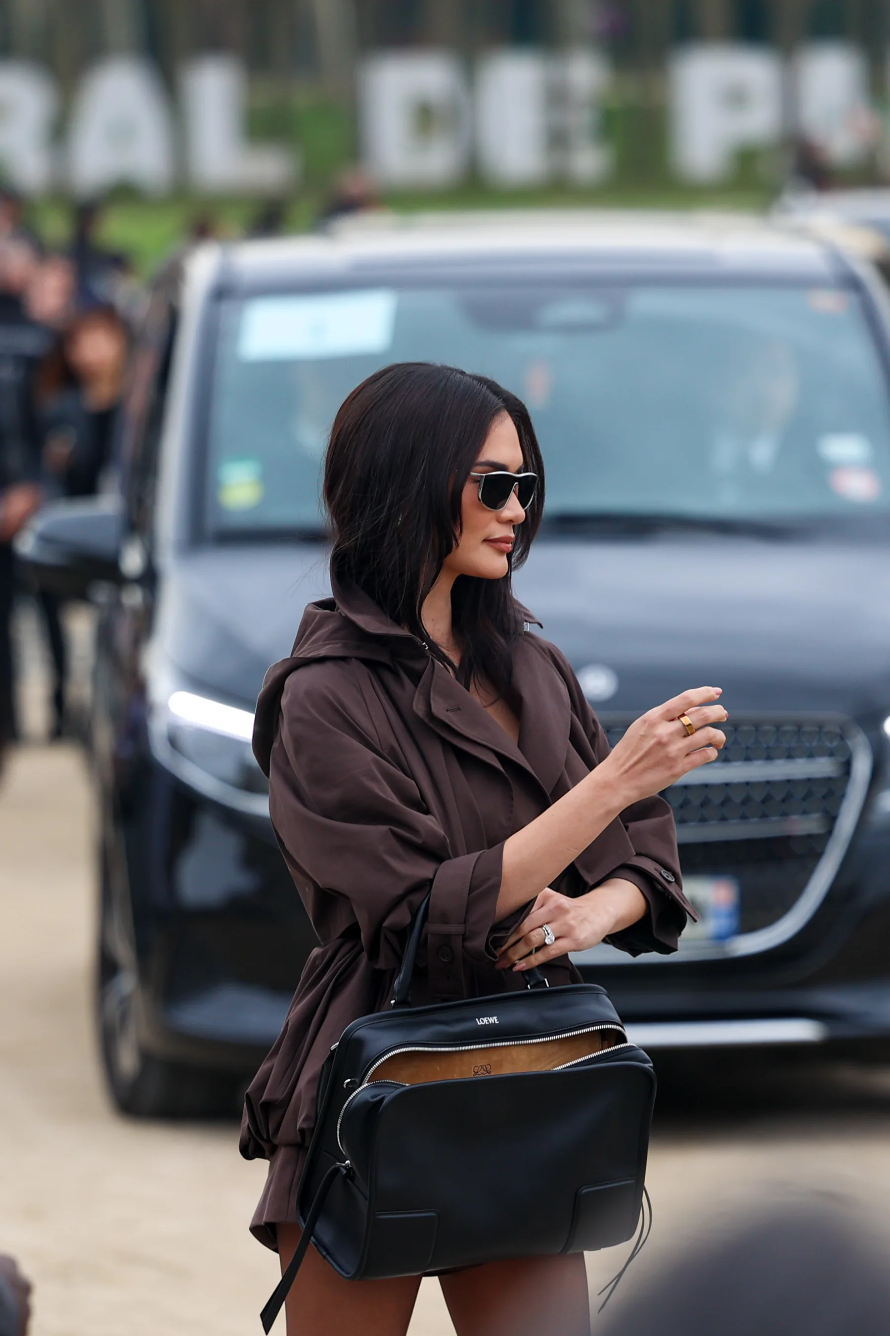 Street-style photograph outside the LOEWE FW26 show during Paris Fashion Week, frame 32 of 34, photographed by Ludovic Delot